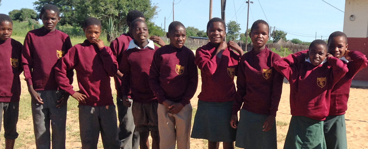 Boys from Nambiai show off sports kit donated by Emmanuel College